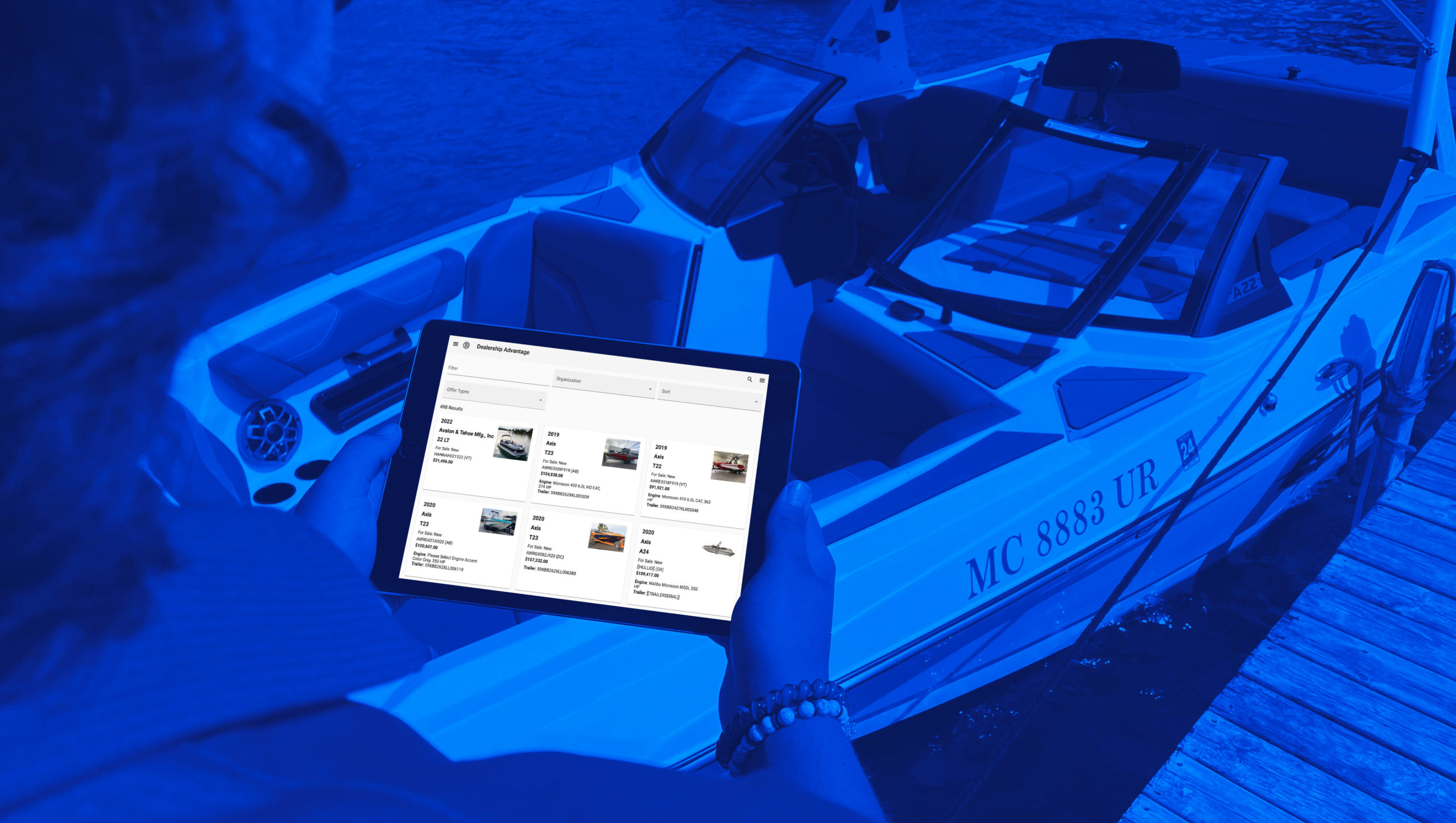 Dock scene with person holding tablet with DMS interface